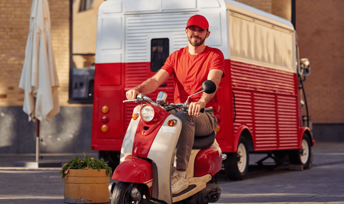 a delivery driver driving a scooter